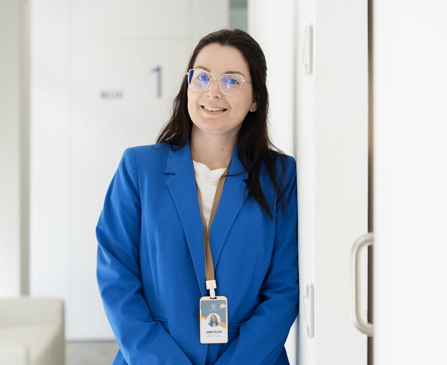confident doctor smiling in modern clinic corridor